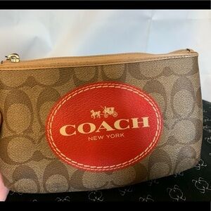 Coach horse and carriage signature wristlet